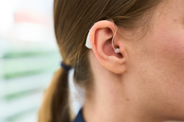 Young woman wearing a hearing aid